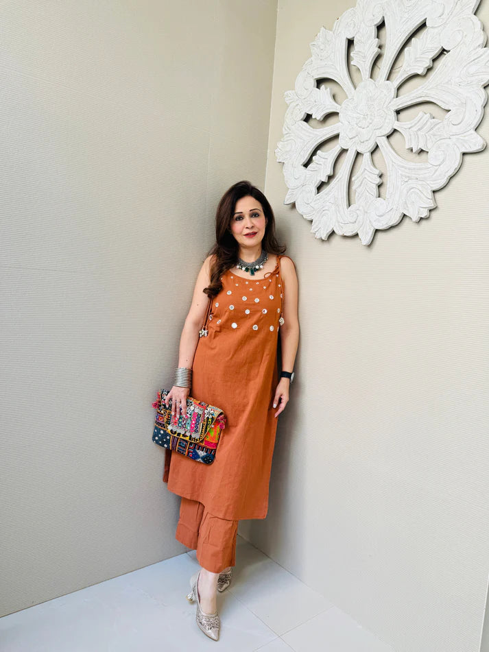 Rust Sleeveless Kurta Set with White Tassel Embellishments