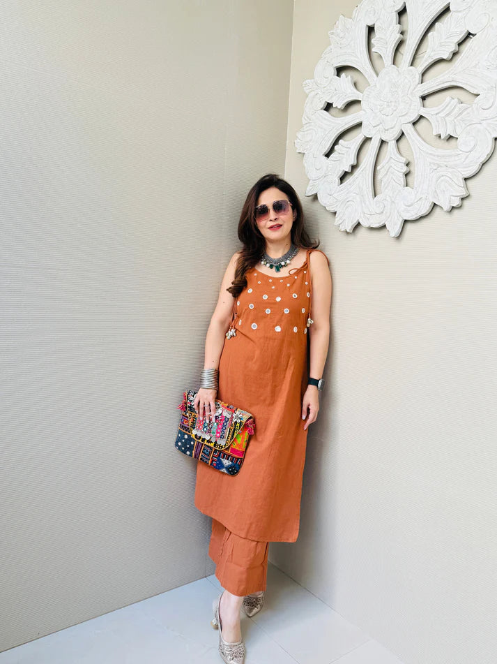 Rust Sleeveless Kurta Set with White Tassel Embellishments