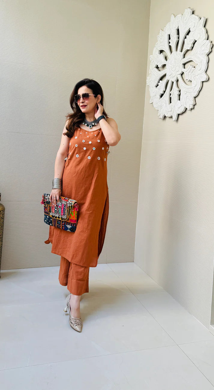 Rust Sleeveless Kurta Set with White Tassel Embellishments