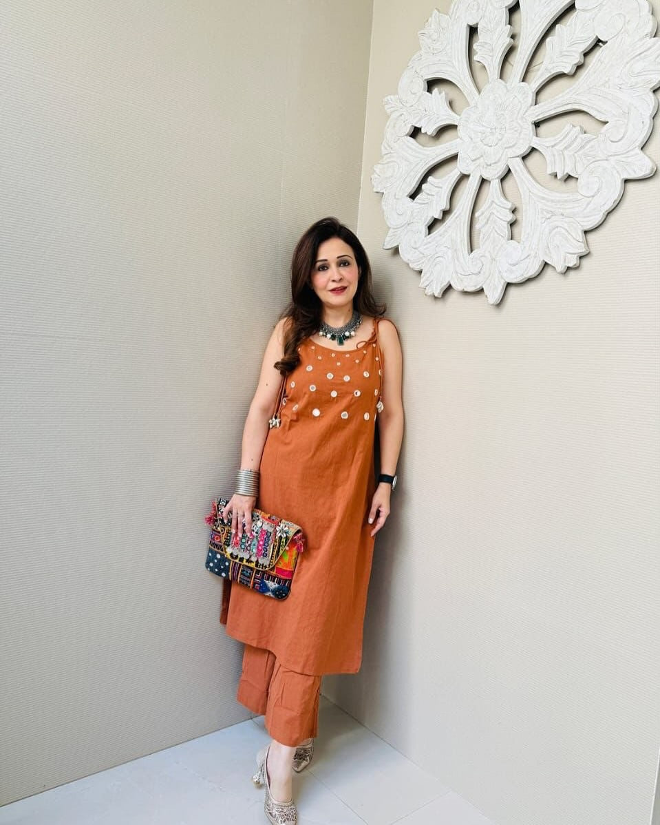Rust Sleeveless Kurta Set with White Tassel Embellishments